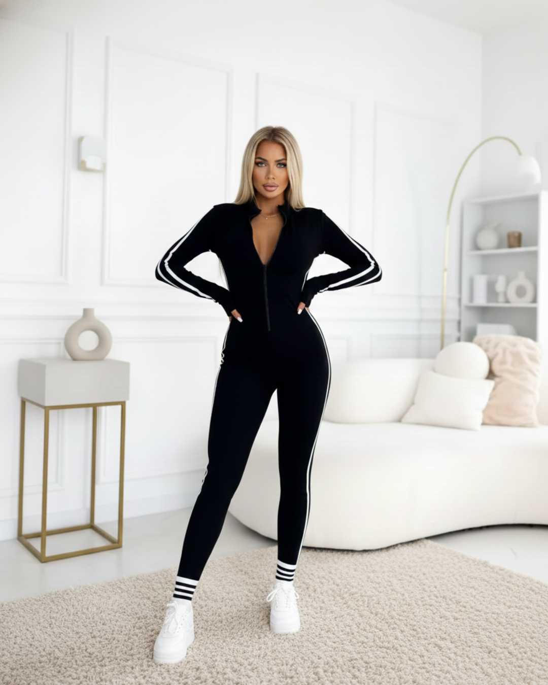 Mono deportivo ajustado con cremallera y bandas laterales para mujer®